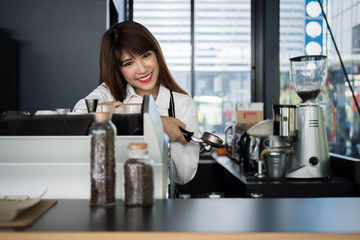 business owner standing in front of the coffee shop with a smile, owners business