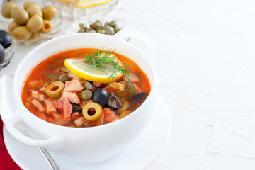 Traditional Russian soup Solyanka in Moscow, horizontal, copy space