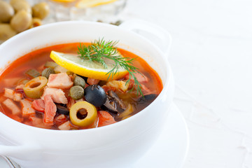 Traditional Russian soup Solyanka in Moscow, horizontal, copy space
