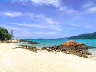 Fototapeta na wymiar White sand beach and blue sea with clear sky in sunny summer day for holiday or vacation concept,Koh Lipe island ,Thailand.