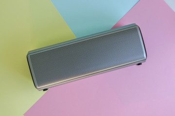 portable bluetooth wireless speaker on pastel background