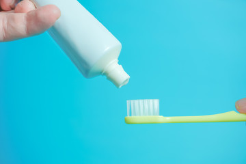 A toothbrush and toothpaste. 歯ブラシと歯磨き粉　水色背景