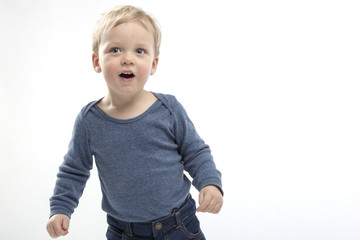 excited open mouthed two years toddler on the white background. copy space