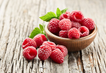 Raspberry on wooden board