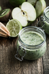 Green fruit smoothie with apple,kiwi, and lime , healthy lifestyle