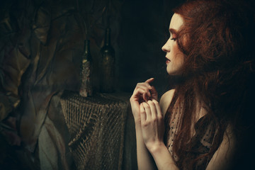 romantic beautiful girl with hairstyle, red lips, art dress.Princess in mistery house. Creative concept Once upon a time in fantasy.