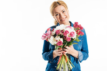 Pretty smiling woman holding bouquet of flowers isolated on white
