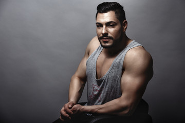 Handsome muscular man posing in studio
