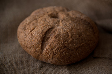 Rustic loaf bread on heavy fabric