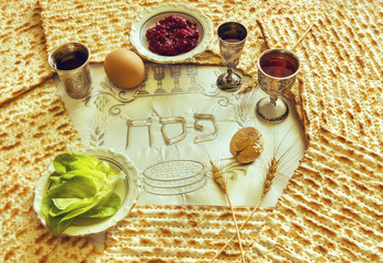 Pesah celebration concept (Jewish Passover Holiday) with traditional kosher food. Three Hebrew...
