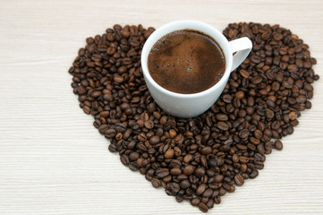 Coffee beans heart. Cup of coffee.