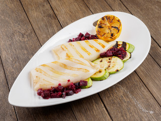 Restaurant dish.Grilled squids and vegetables.