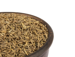 Cumin seeds or caraway isolated on white background