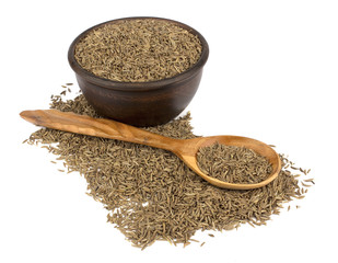 Cumin seeds or caraway isolated on white background. Cumin in spoon.