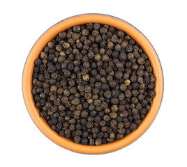 Black pepper in bowl isolated on white background