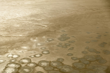 Beautiful abstract landscape image taken from airplane window above the Salar de Uyuni during sunrise