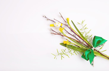 Spring bouquet of daffodils, and a willow on a white background.