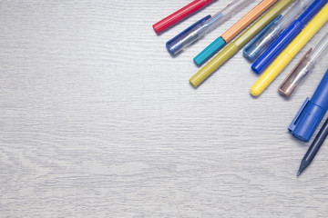 Obraz premium Notepad with pencils and colorfull markers