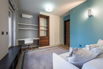 Fototapeta na wymiar Bedroom interior in modern luxury apartment