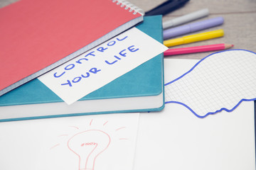 Notepad with pencils and colorfull markers