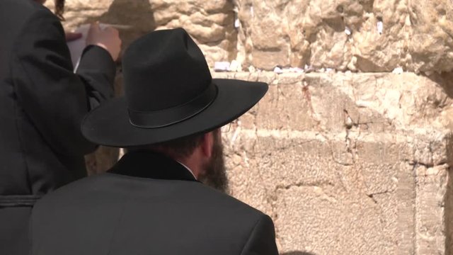 Jewish man praying at the Wailing Wall
