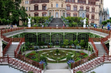 Naklejka premium Orangerie in the public gardens surrounding Schwerin Palace, or Schwerin Castle (Schweriner Schloss), in the city of Schwerin, capital of Mecklenburg-Vorpommern state, Germany. 