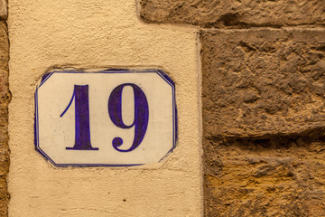 numerical tile on a stone wall background