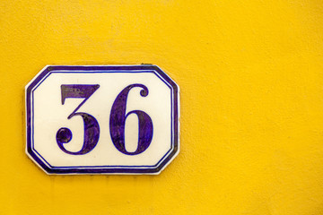 numerical tile on a stone wall background