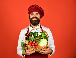 Green grocery concept. Man with beard on red background