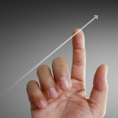 Businessman with financial symbols coming