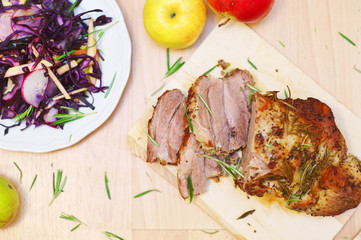 Tasty Beef steak with herbs and spices a cutting board, red cabbage coleslaw on the plate, wood background, style rustic. View from top. Close-up, selective focus