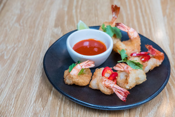 Fried shrimp on plate with sauce for served in a restaurant