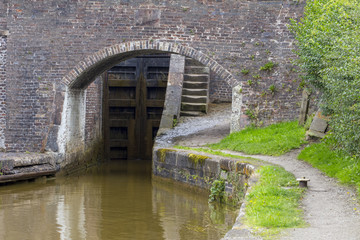 Canal lock with arch bridge in Cheshire UK