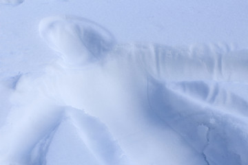 the trace of a man's body on the snow, the shape silhouette