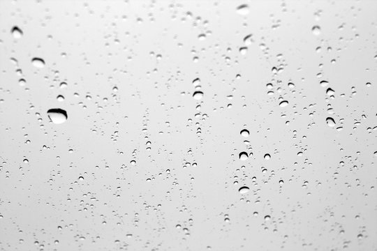 Rain Drops On Car Window In Black And White.