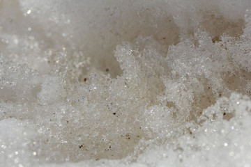 Texture of melting snow, ice crystals close-up. Abstract background