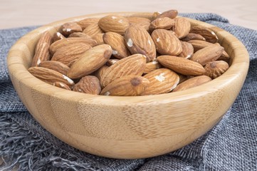 macro of a bowl full of almonds