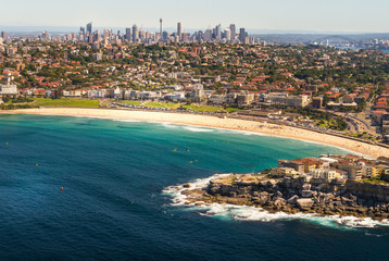 Aerial view from a small plane of Bondi beach, Sydney, Australia. A group of people can be seen...