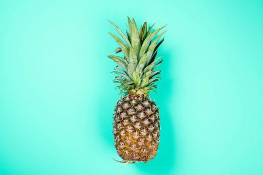 Pineapple on color background