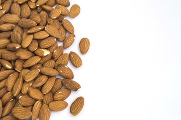 group of almonds on the side on white background