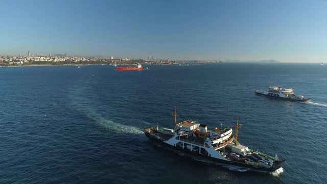 Ships floating Bosphorus blue water sunny day. Aerial drone view on sunset in Istanbul, Turkey
