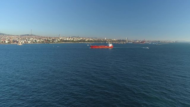 Ships floating Bosphorus blue water sunny day. Aerial drone view on sunset in Istanbul, Turkey