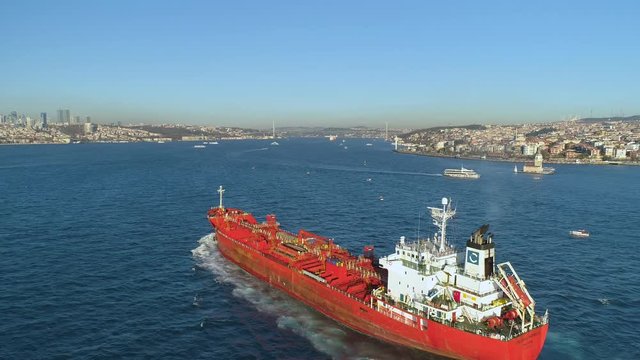 Ships floating Bosphorus blue water sunny day. Aerial drone view on sunset in Istanbul, Turkey