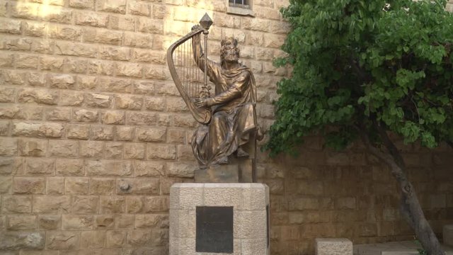 Bronze statue of David playing the harp