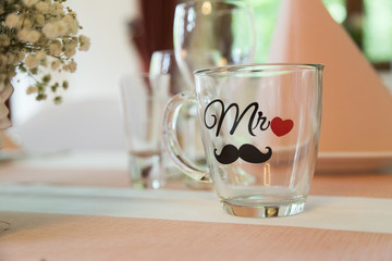 Empty transparent glass cup for tea or coffee with a handle