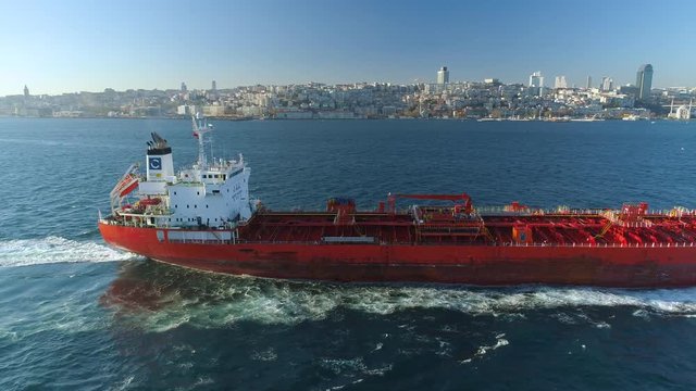 Ships floating Bosphorus blue water sunny day. Aerial drone view on sunset in Istanbul, Turkey
