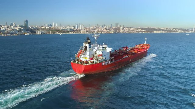 Ships floating Bosphorus blue water sunny day. Aerial drone view on sunset in Istanbul, Turkey