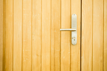 Door Handles stainless steel with wooden door.