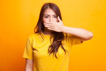 Young Asian woman close her mouth with hand.