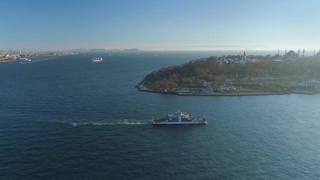 Ships floating Bosphorus blue water sunny day. Aerial drone view on sunset in Istanbul, Turkey
